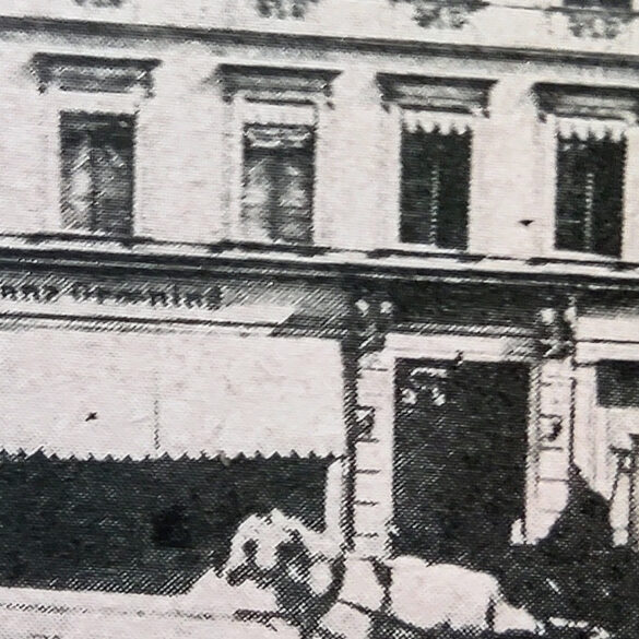 Zbliżenie na biznes, który prowadził Franz, na rogu budynku
